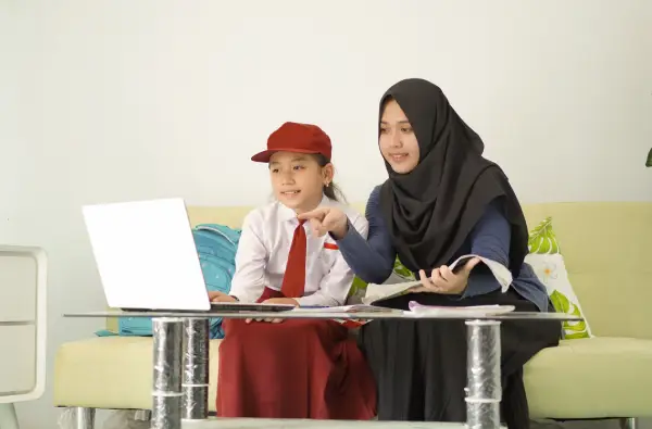 elementary-school-children-who-are-helped-by-their-2026-01-07-06-33-16-utc